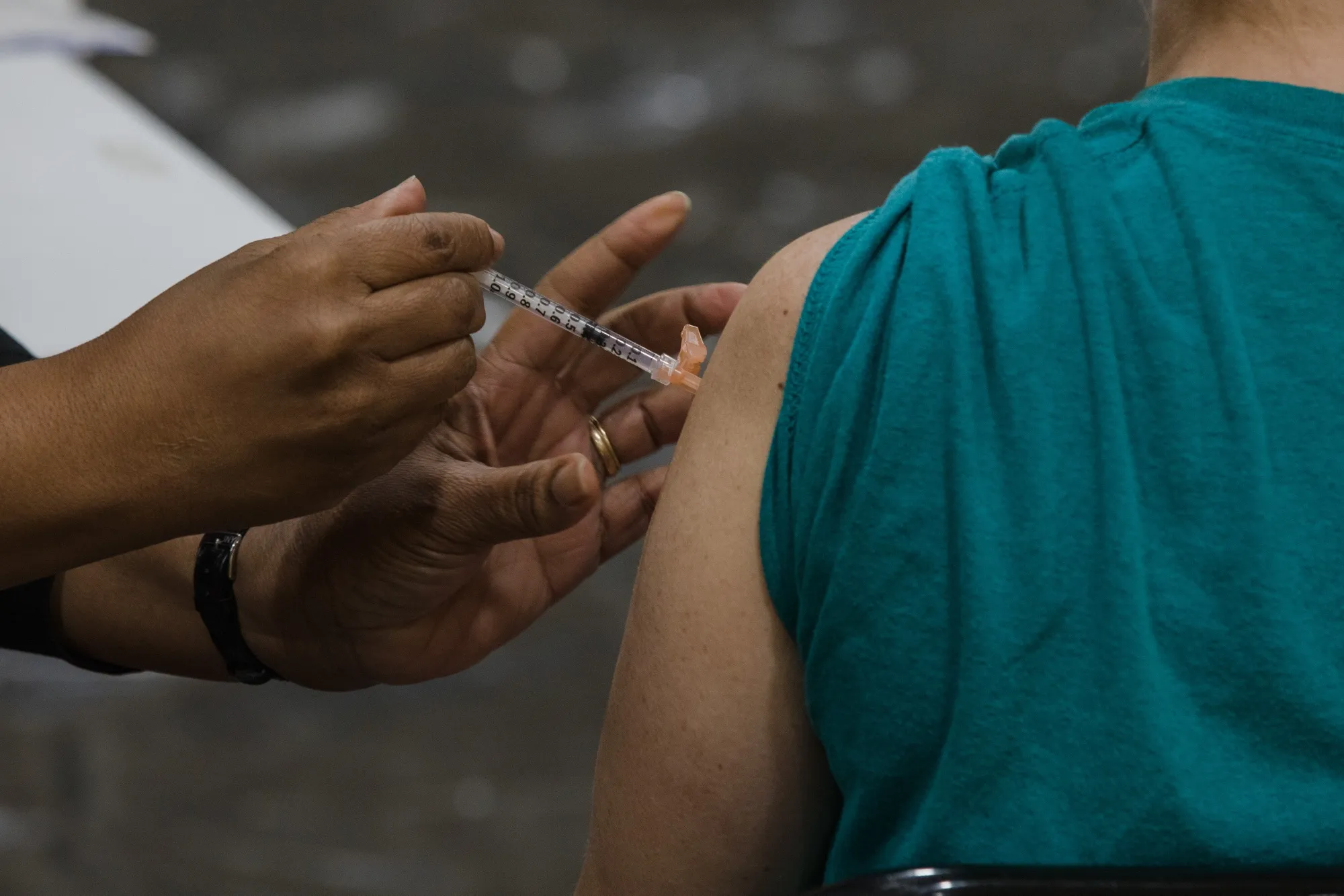 A healthcare worker administers a dose of the Pfizer-BioNTech Covid-19 vaccine in Manning, South Carolina