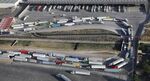 Freight trucks, as seen from a helicopter, snake from Mexico into California as they are inspected at U.S. Customs at the Otay Mesa port of entry on May 11, 2017 in San Diego, California.&nbsp;