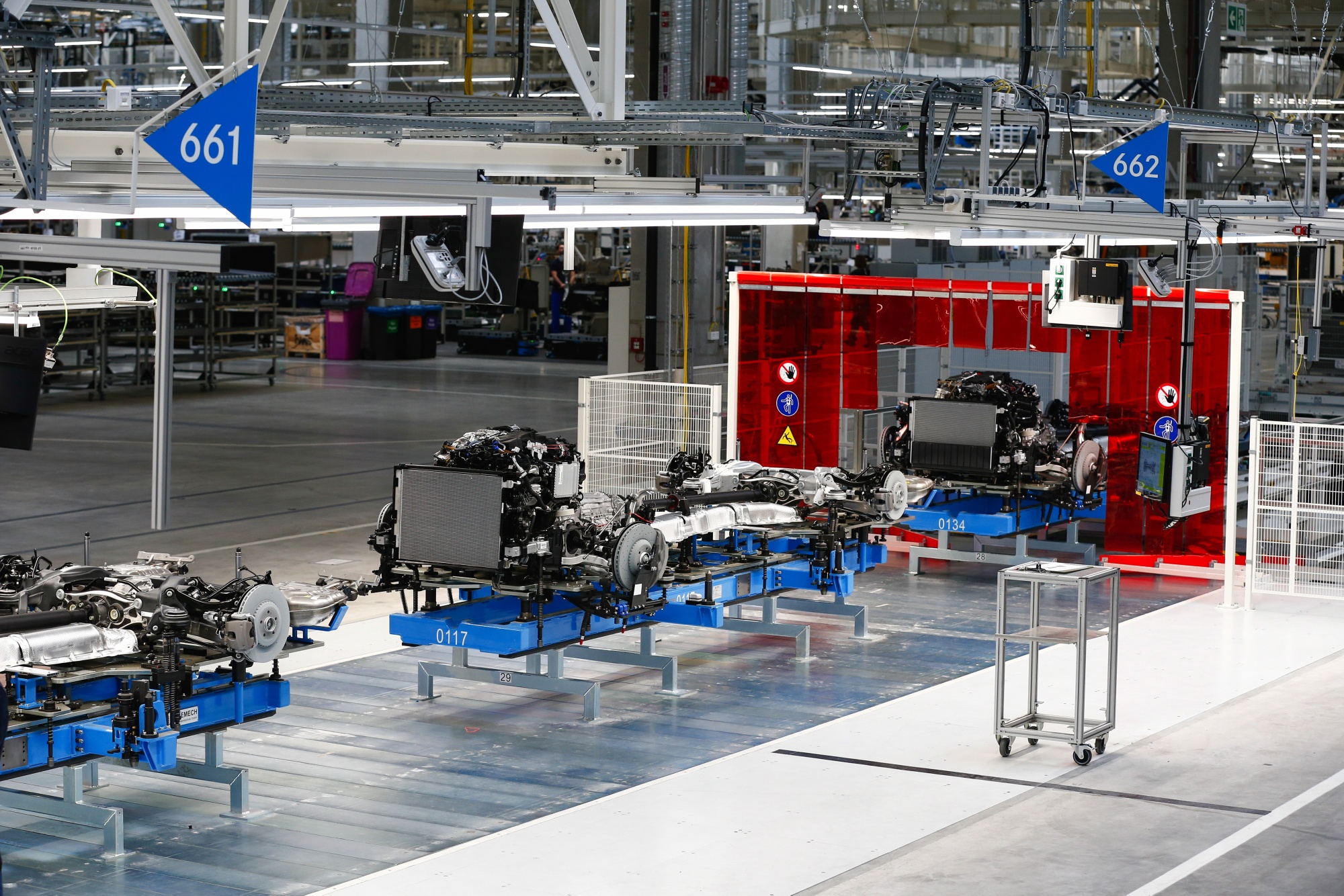 Combustion engines stand on trolleys on the Mercedes S-Class luxury sedan assembly line at the Mercedes-Benz AG Factory 56, operated by Daimler AG, in Sindelfingen, Germany, on Wednesday, Sept. 2, 2020. The latest iteration of the Mercedes S-Class, which the German carmaker presents on Wednesday, will try to please tastes old and new -- offering not just the high-powered combustion variant but also an improved hybrid version and, for the first time, a sleek all-electric sibling sold from next year. Photographer: Michaela Handrek-Rehle/Bloomberg