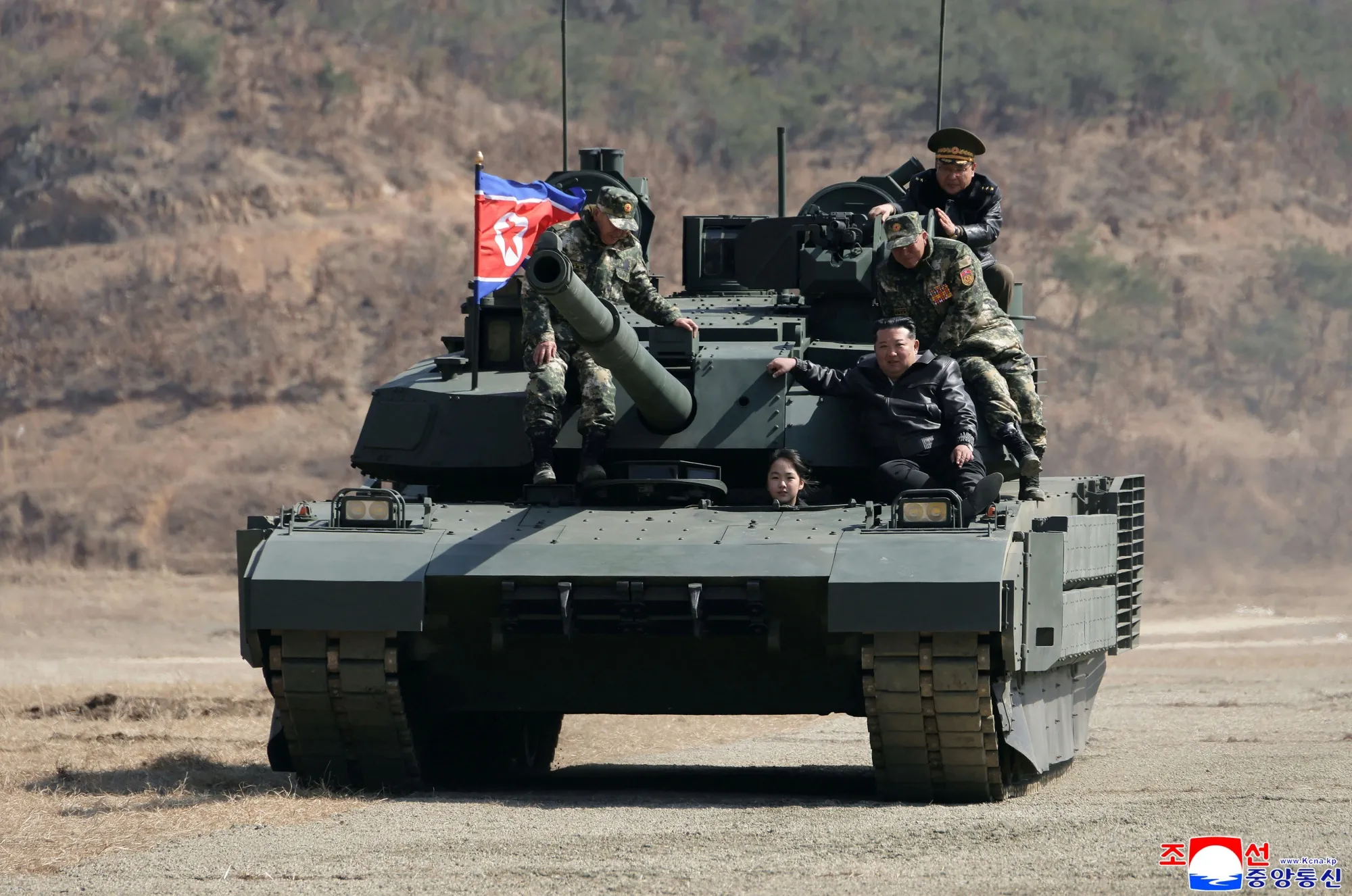 Kim Jong Un, front right, with his daughter Kim Ju Ae and other soldiers on a tank at a military training base, in a photo provided by the North Korean government.