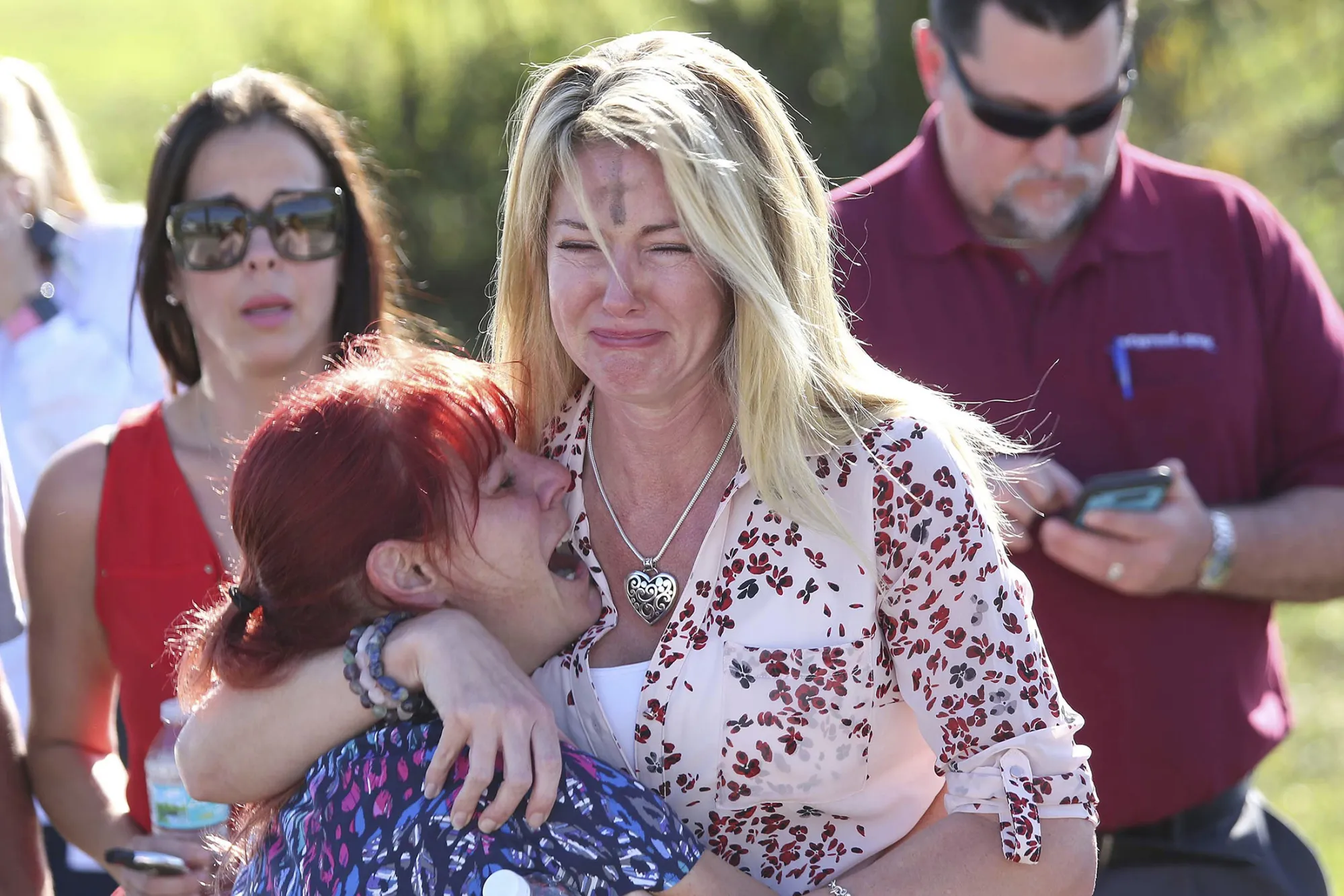 Parents wait for news after a reports of a shooting at a high school in Parkland, Florida, on Feb. 14, 2018.