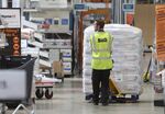 An employee maneuvers a pallet inside a B&amp;Q store in London.