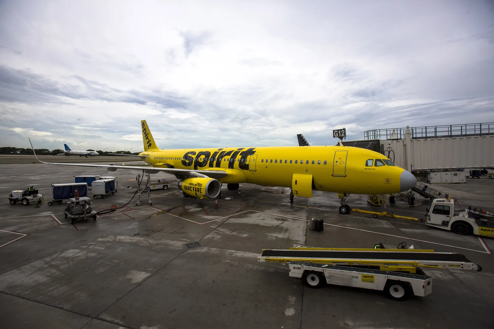 A Spirit Airlines plane sits on the tarmac at Fort Lauderdale International Airport in Fort Lauderdale, Florida.