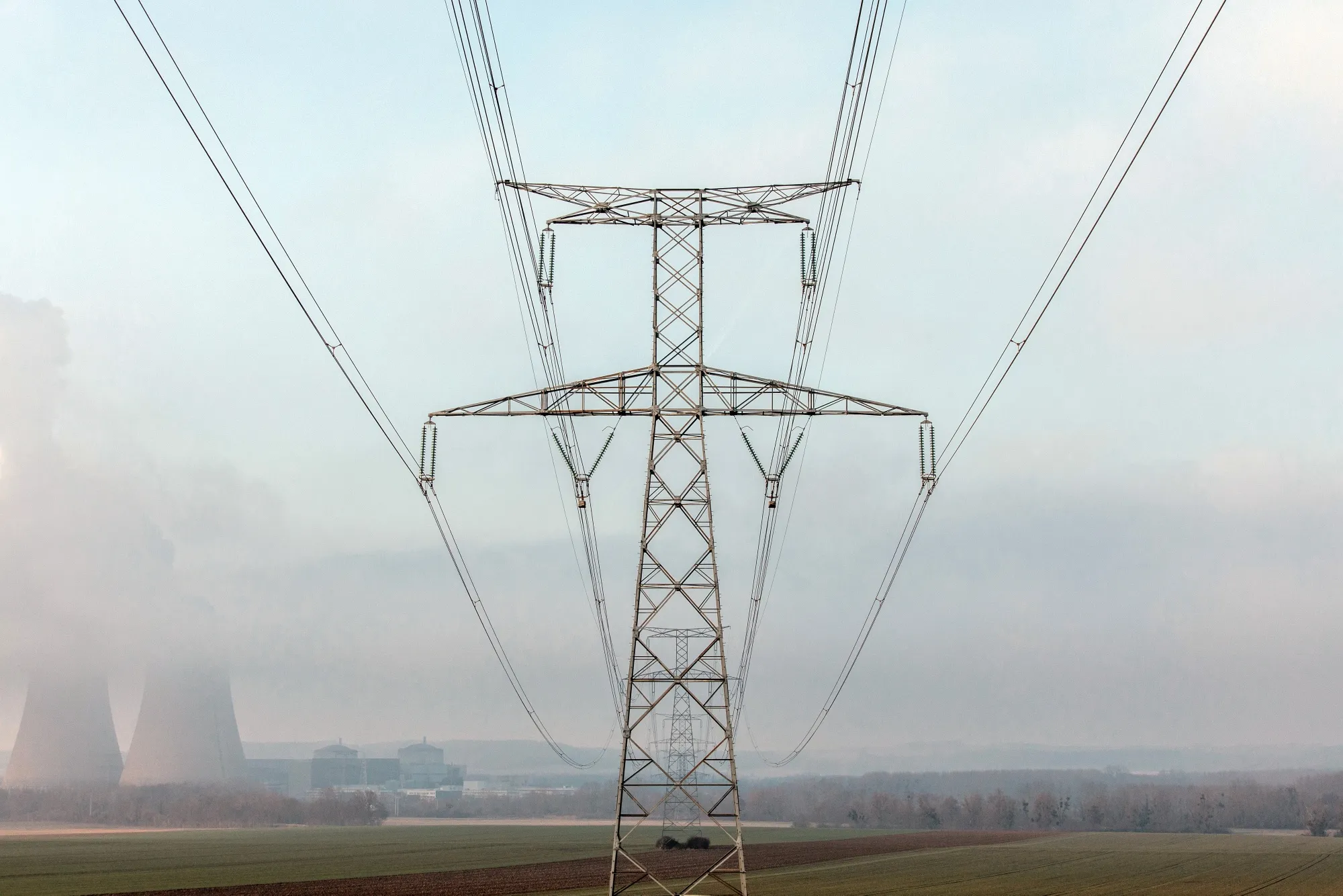 High tension electricity pylons on agricultural land near the Nogent nuclear power plant, operated by Electricite de France SA, in Nogent-sur-Seine, France.