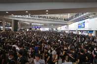Hong Kong Cancels Monday Flights as Protesters Swarm Airport