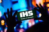 In this photo illustration, the IHS Towers logo is displayed