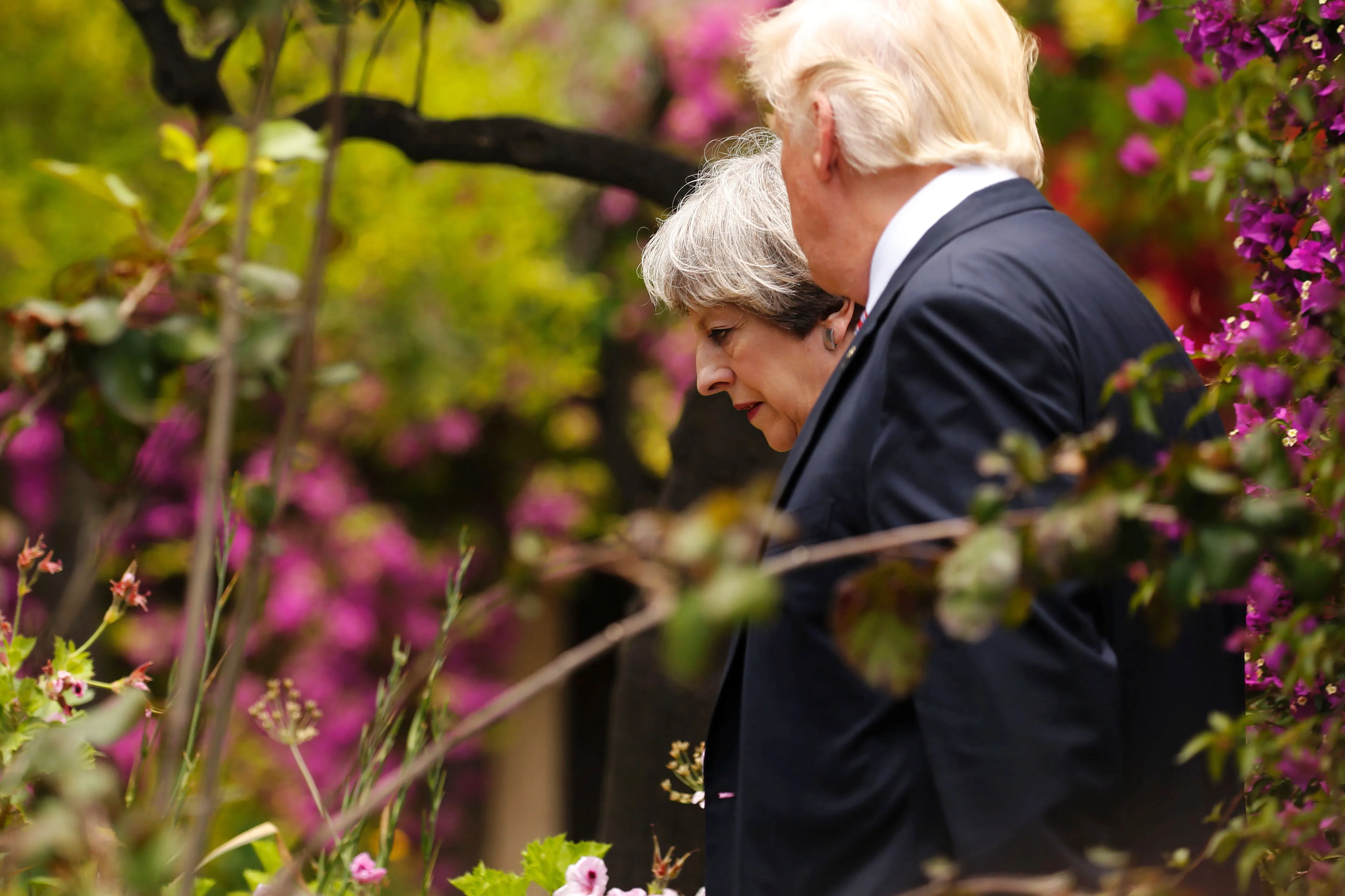 Donald Trump speaks to Theresa May at the G7 Summit in Taormina, on May 26, 2017.
