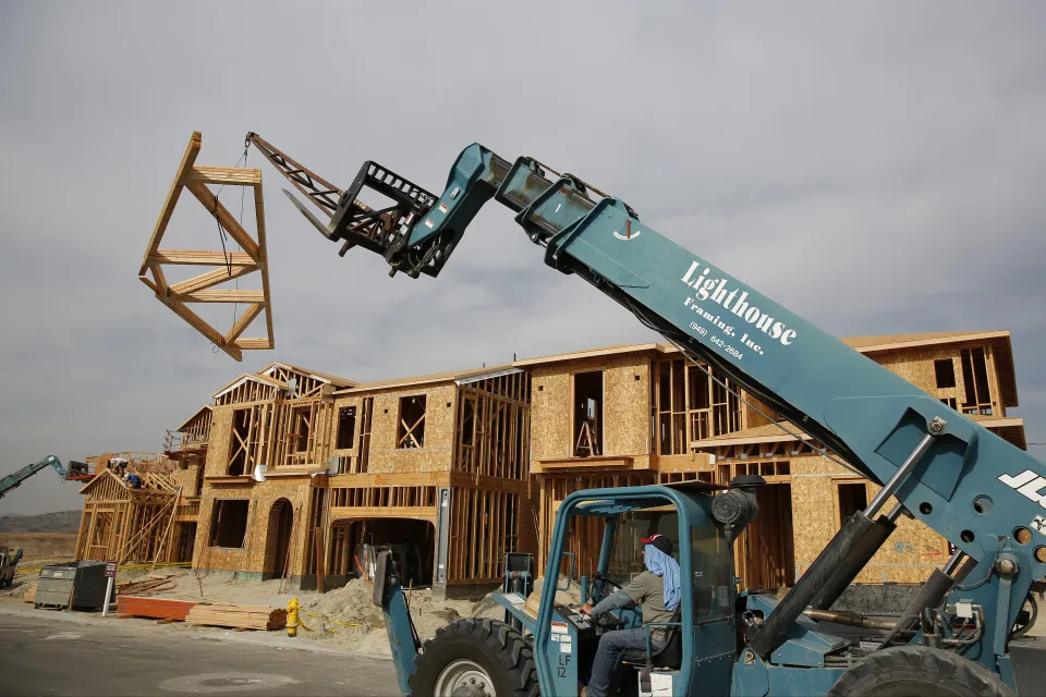 Workers frame new homes in Lake Forest, California.