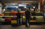 Customers shop for vegetables at the Central de Abastos Market in Mexico City, Mexico.