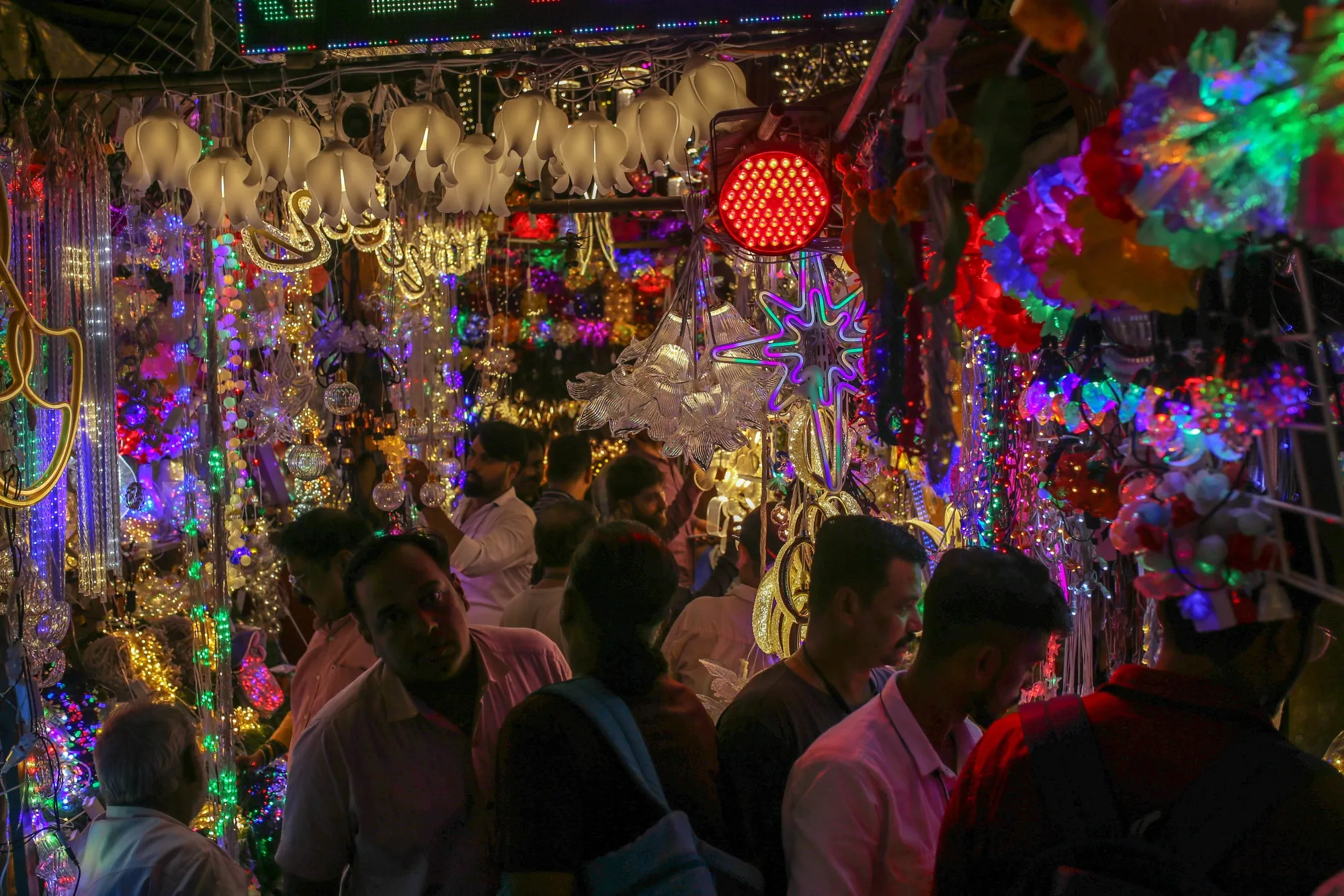 Shoppers at a festive light stall at Crawford Market in Mumbai.