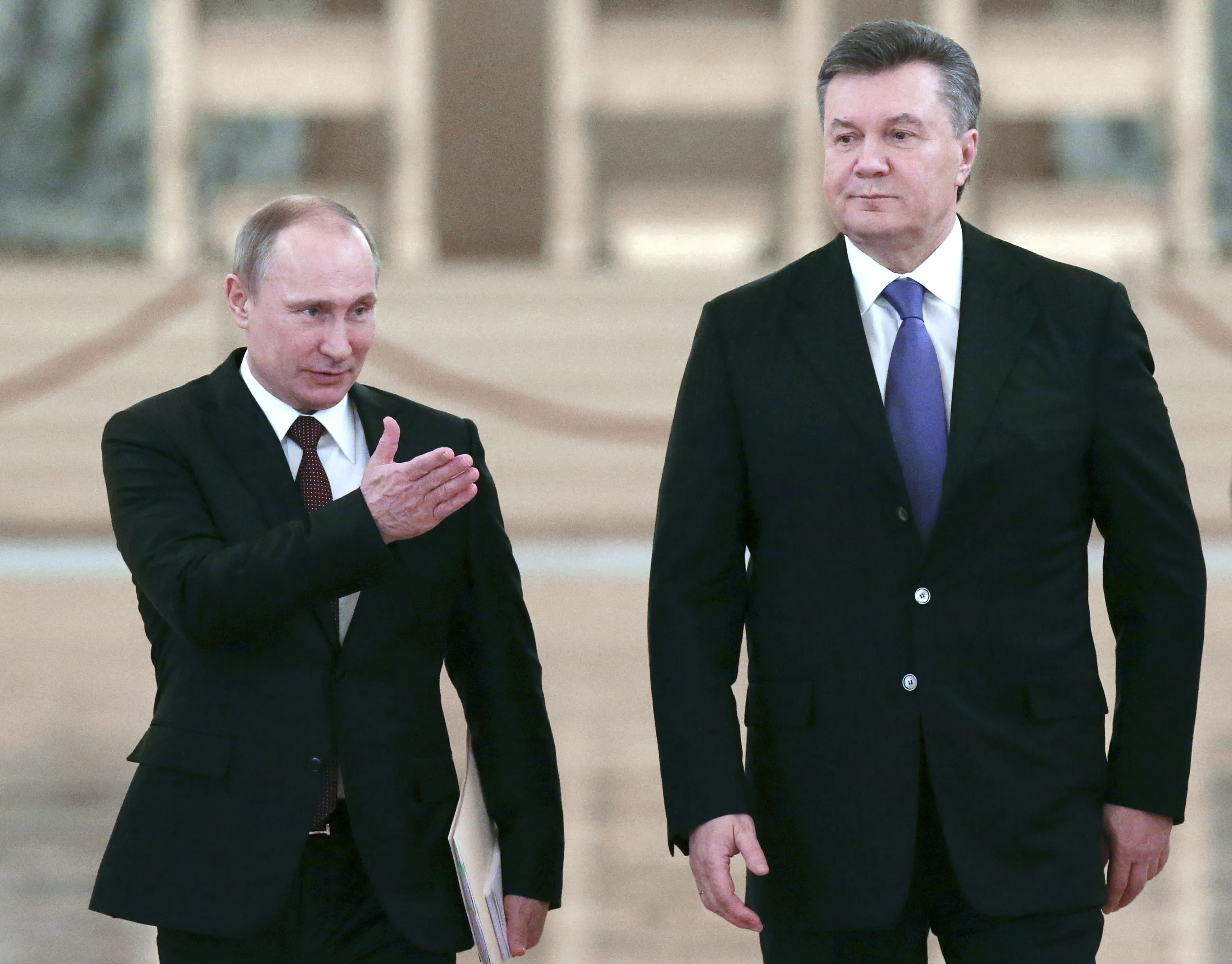 Now that Ukraine's protesters have forced concessions from the government, can Russia's Putin hold on to power? Photographer: Sergei Karpukhin/AFP/Getty Images