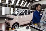 A worker on the assembly line at SAIC-GM-Wuling Automobile’s&nbsp;Baojun Auto City in Liuzhou, China.