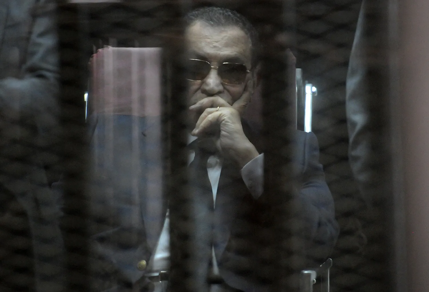 Ousted Egyptian president Hosni Mubarak sits in the defendants cage in Cairo, on May 9, 2015.
