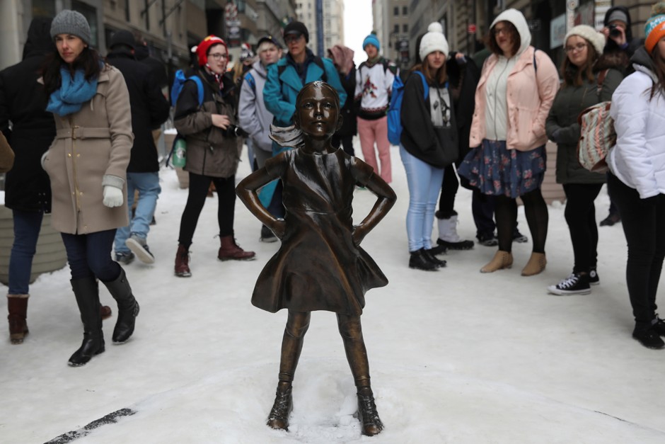 In New York City, a 'Fearless Girl' statue now stands in front of Wall Street's charging bull statue. 