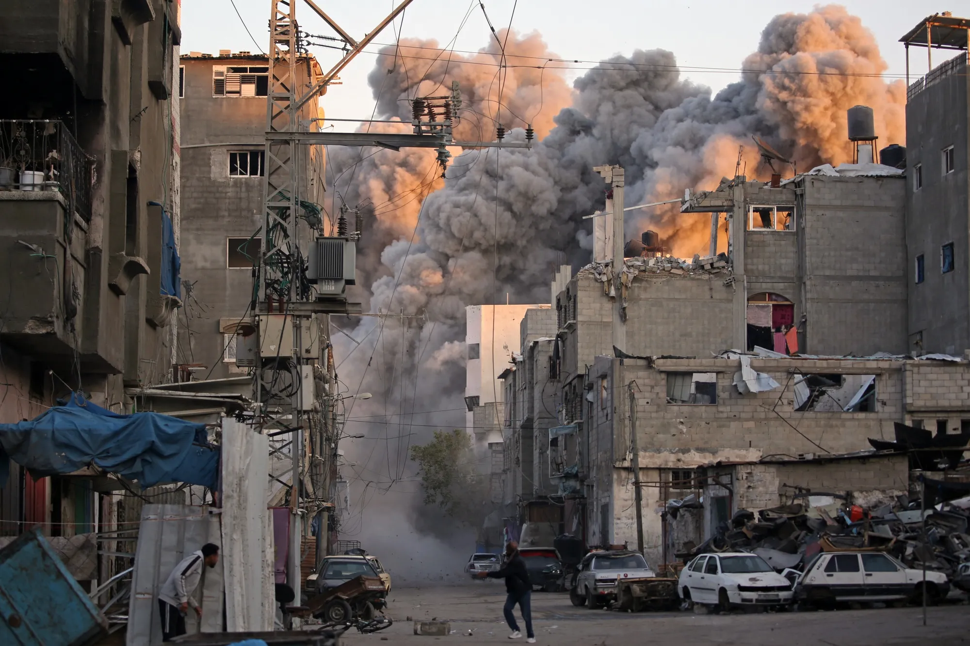 Smoke rises from a building destroyed in Israeli airstrike at the Bureij camp for Palestinian refugees in the central Gaza Strip on Jan.&nbsp;12.