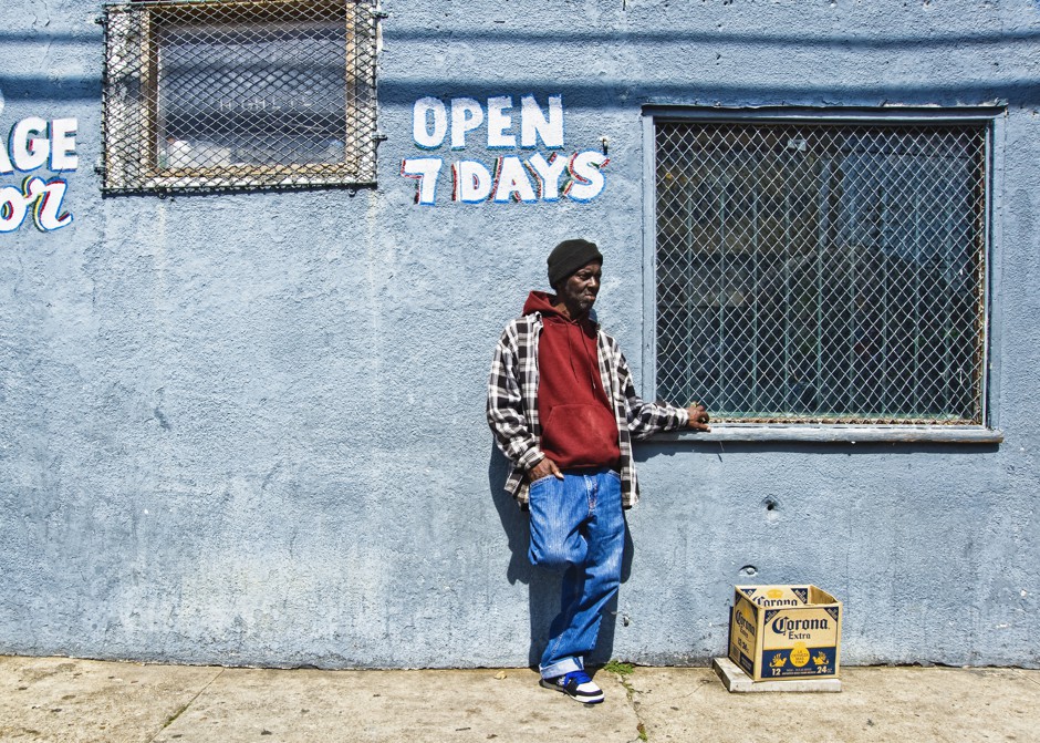 A man stands in front of a store in New Orleans on Super Sunday, 2010
