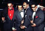  The Four Tops, from left, Renaldo &quot;Obie&quot; Benson, Levi Stubbs Abdul &quot;Duke&quot; Fakir, and Lawrence Payton hold their awards after being inducted into the Rock and Roll Hall of Fame in New York on Jan. 17, 1990. Fakir wrote a memoir, &quot;I'll Be There: My Life With The Four Tops.&quot; (AP Photo/Ron Frehm, File)