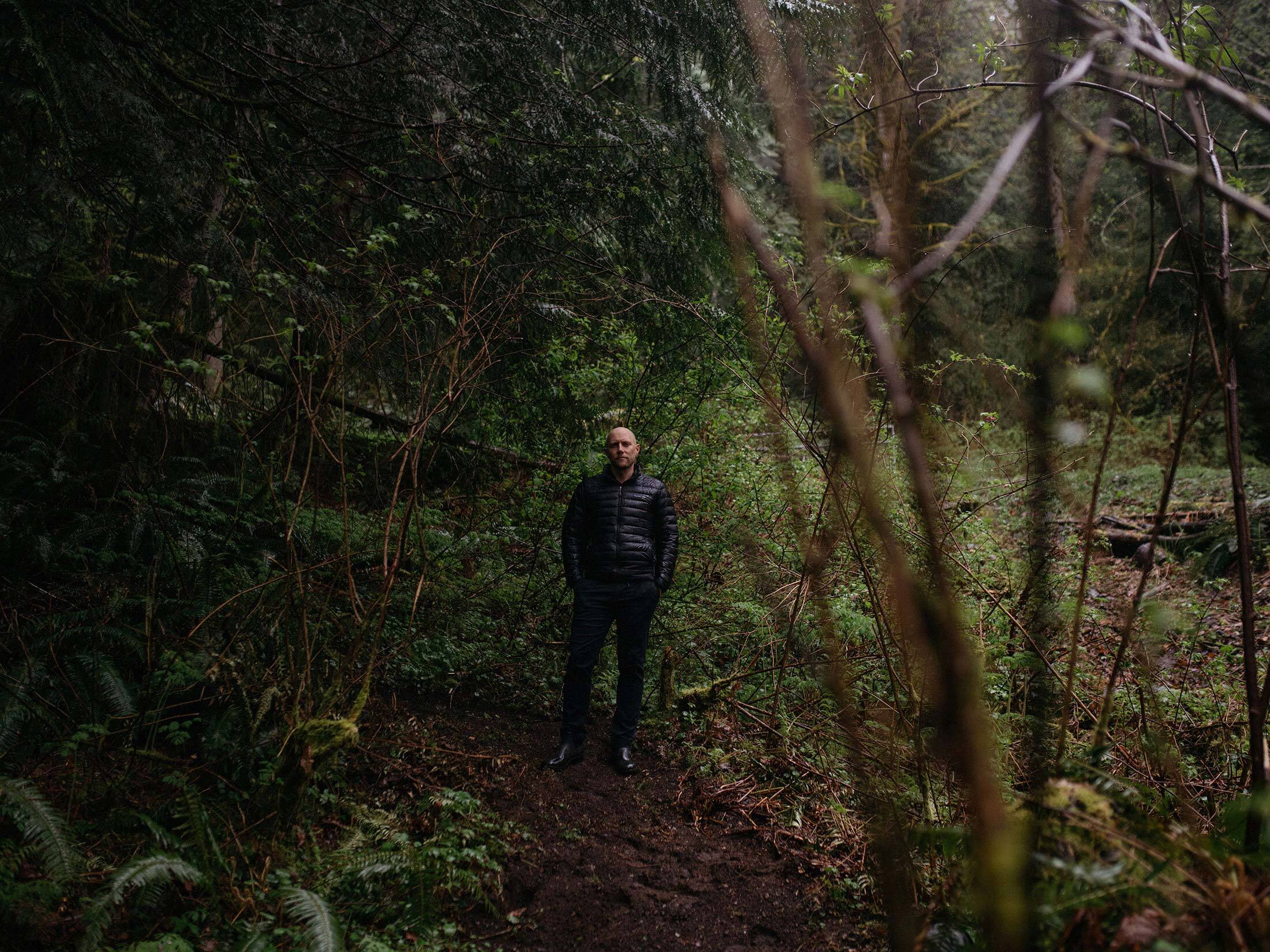 Lucas Joppa on a trail at his North Bend, Wash., home in the foothills of the Cascade Mountains. His work-from-home view includes bears and bobcats.
