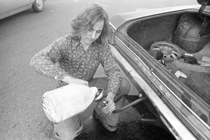 Motorist Pours Gas Into Car From Jug During 'Oil Crisis'