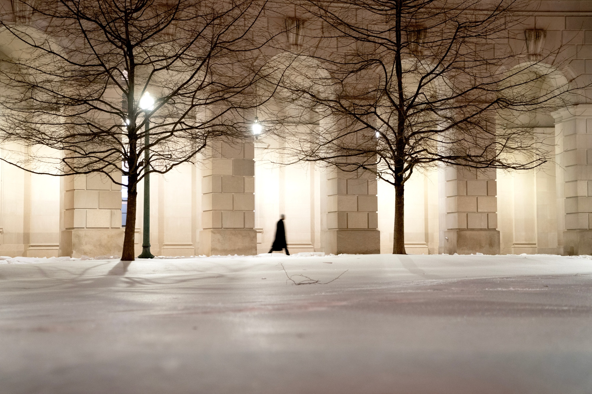 A pedestrian walks near the Environmental Protection Agency (EPA) headquarters in Washington, DC, US, on Tuesday, Feb. 10, 2026. The US Environmental Protection Agency plans this week to repeal a policy that provides the legal foundation for a raft of rules regulating greenhouse gas emissions, marking President Donald Trump's most consequential retreat from the fight against climate change. Photographer: Stefani Reynolds/Bloomberg