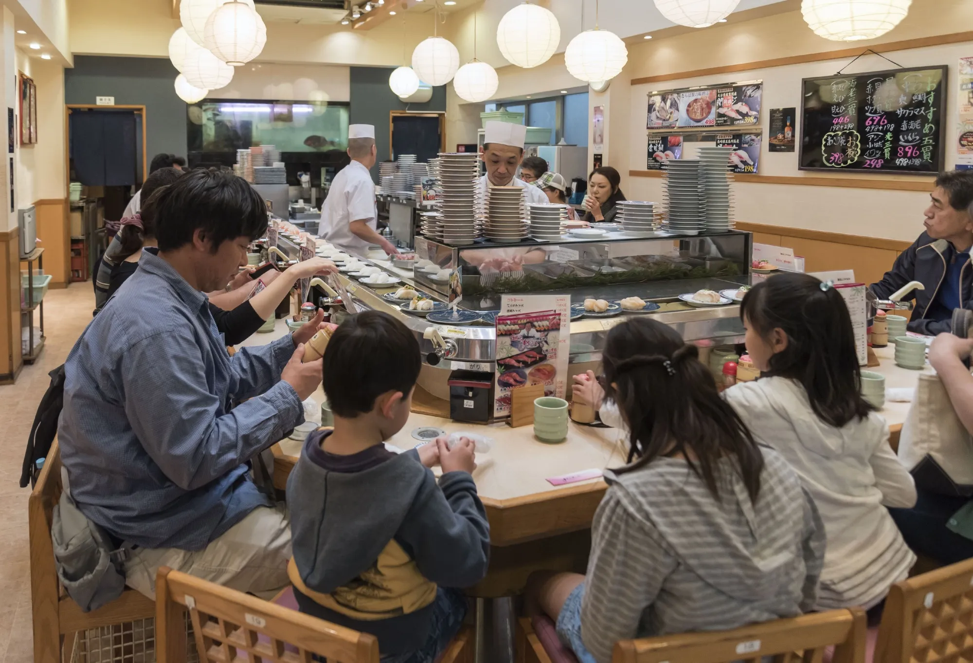 A conveyor belt sushi restaurant at the Tsukiji fish market, Tokyo.