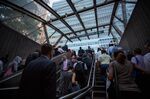 Commuters exit the Bowling Green subway station near the New York Stock Exchange (NYSE) in New York, U.S., on Friday, Aug. 25, 2017.&nbsp;
