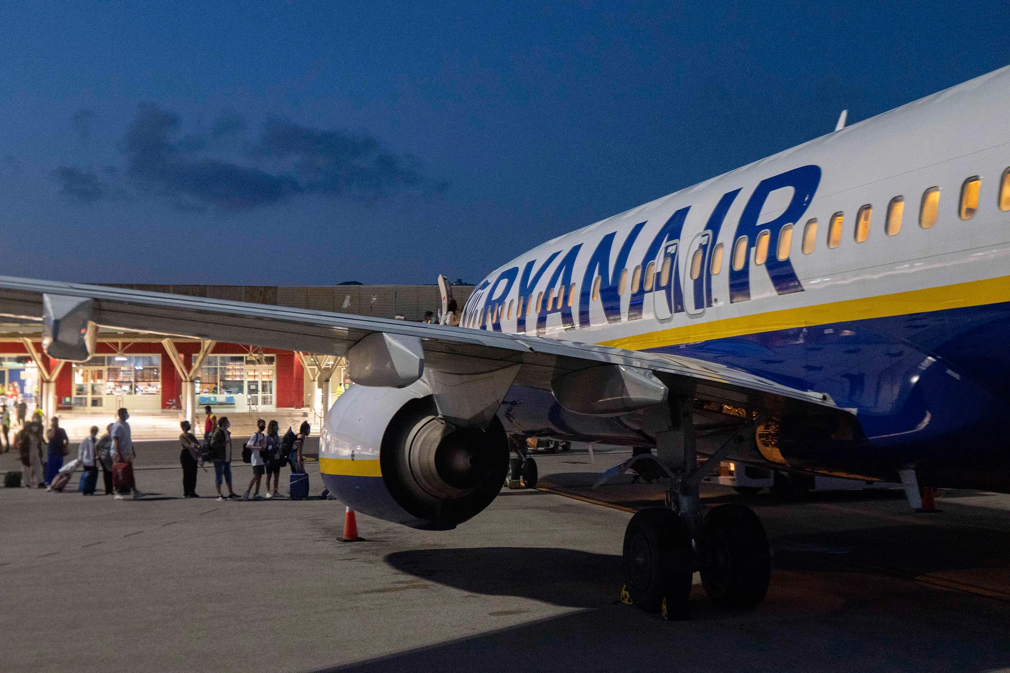 Passengers Boarding Airplane During The Pandemic