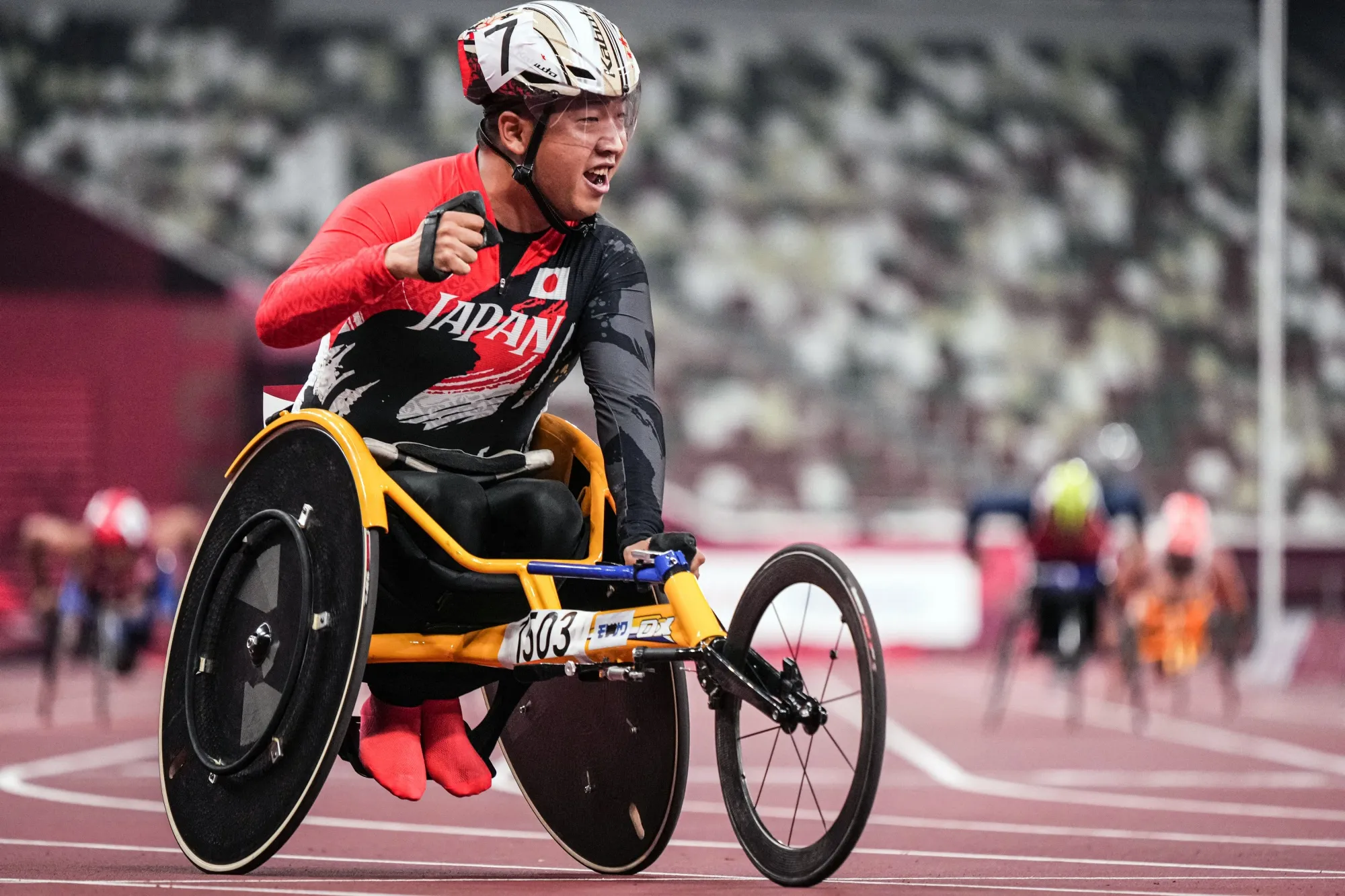 Tomoki Sato reacts after winning the men’s 400m (T52) final of the Tokyo 2020 Paralympic Games.