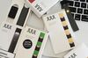 A Juul Labs Inc. e-cigarette, USB charger, and flavored pods are arranged for a photograph in the Brooklyn Borough of New York, U.S., on Sunday July 8, 2018. Juul Labs, the maker of the popular e-cigarette brand that has recently come under fire from health officials over its popularity with young adults, plans to introduce a line of lower-nicotine pods. The company will begin to sell pods with a 3-percent nicotine concentration in its mint and Virginia tobacco flavors later this year, according to a statement Thursday.
