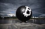 
The Bitcoin symbol painted on a stone sphere monument in Oktyabrskaya Square in Yekaterinburg, Russia. 
Photographer: Donat Sorokin/TASS/Getty Images