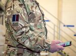 A member of Britain’s Royal Air Force tests a beta version of the NHS contact-tracing app.