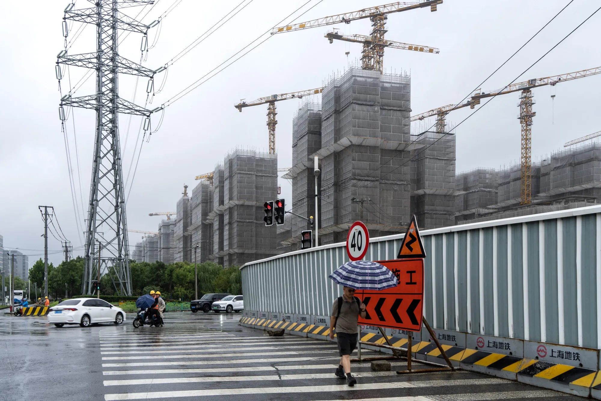 An electricity tower near a residential apartment block construction site in Shanghai.