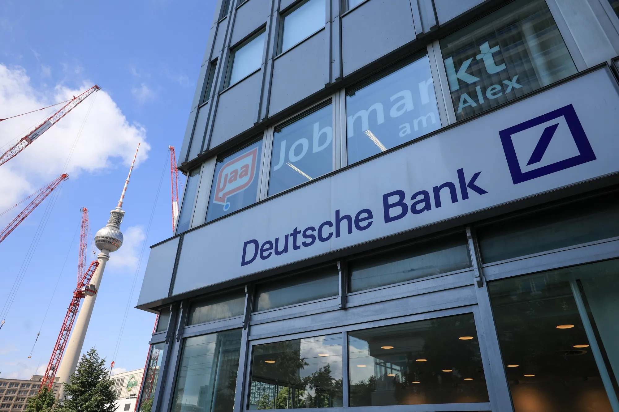 The TV Tower near a Deutsche Bank AG bank branch in Berlin, Germany, on Wednesday, July 24, 2024.&nbsp;