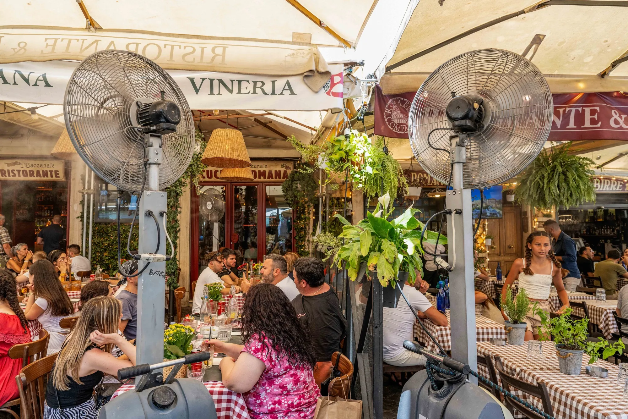 Misting fans cool down customers at a restaurant in Campo de' Fiori in Rome on July 13.