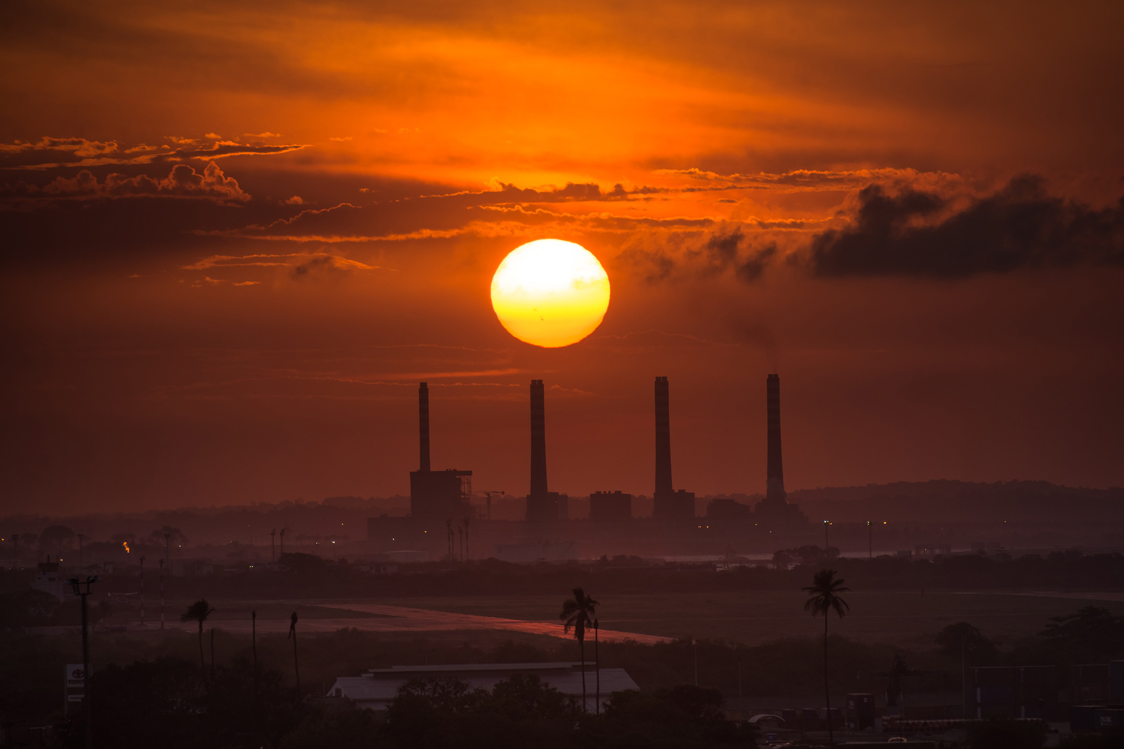 The sun sets over El Palito oil refinery in Puerto Cabello, Venezuela, on Monday, Aug. 24, 2015.

