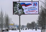 A billboard dedicated to the “Defender of the Fatherland Day”&nbsp;reads “For victory! For ours! For truth!”&nbsp;on a street in Moscow, on Feb. 20.&nbsp;