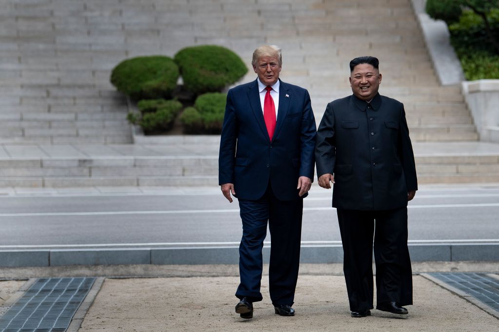 US President Donald Trump and North Korea&#39;s leader Kim Jong-un walk on North Korean soil toward South Korea in the Demilitarized Zone(DMZ) on June 30, 2019, in Panmunjom, Korea. (Photo by Brendan Smialowski &#x2F; AFP) (Photo credit should read BRENDAN SMIALOWSKI&#x2F;AFP via Getty Images) Photographer: BRENDAN SMIALOWSKI&#x2F;AFP