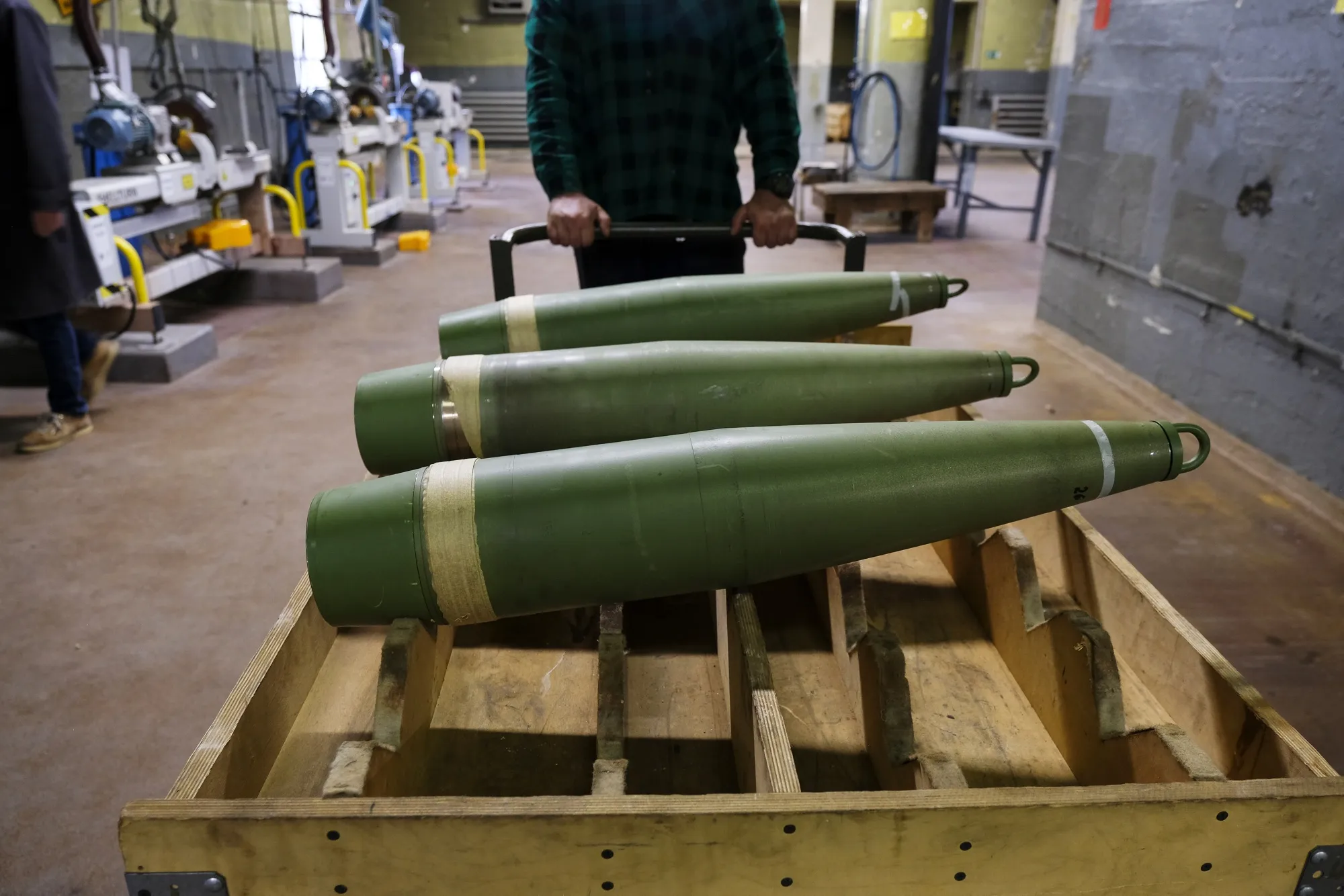 A worker moves&nbsp;155mm&nbsp;ammunition at a factory in Bydgoszcz, Poland.