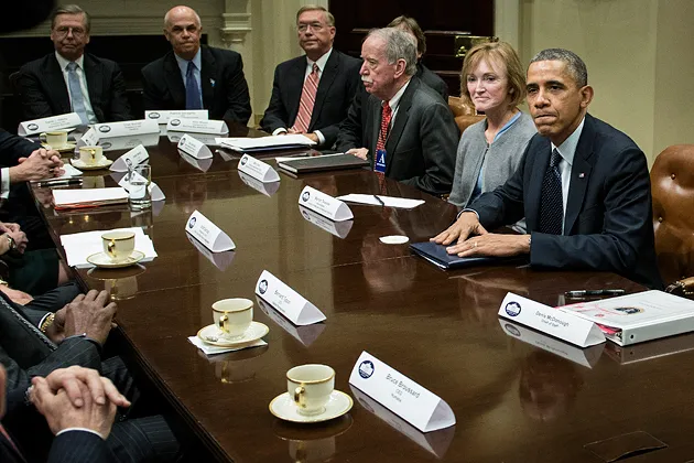 President Obama with insurance industry executives and members of his administration on Nov. 15