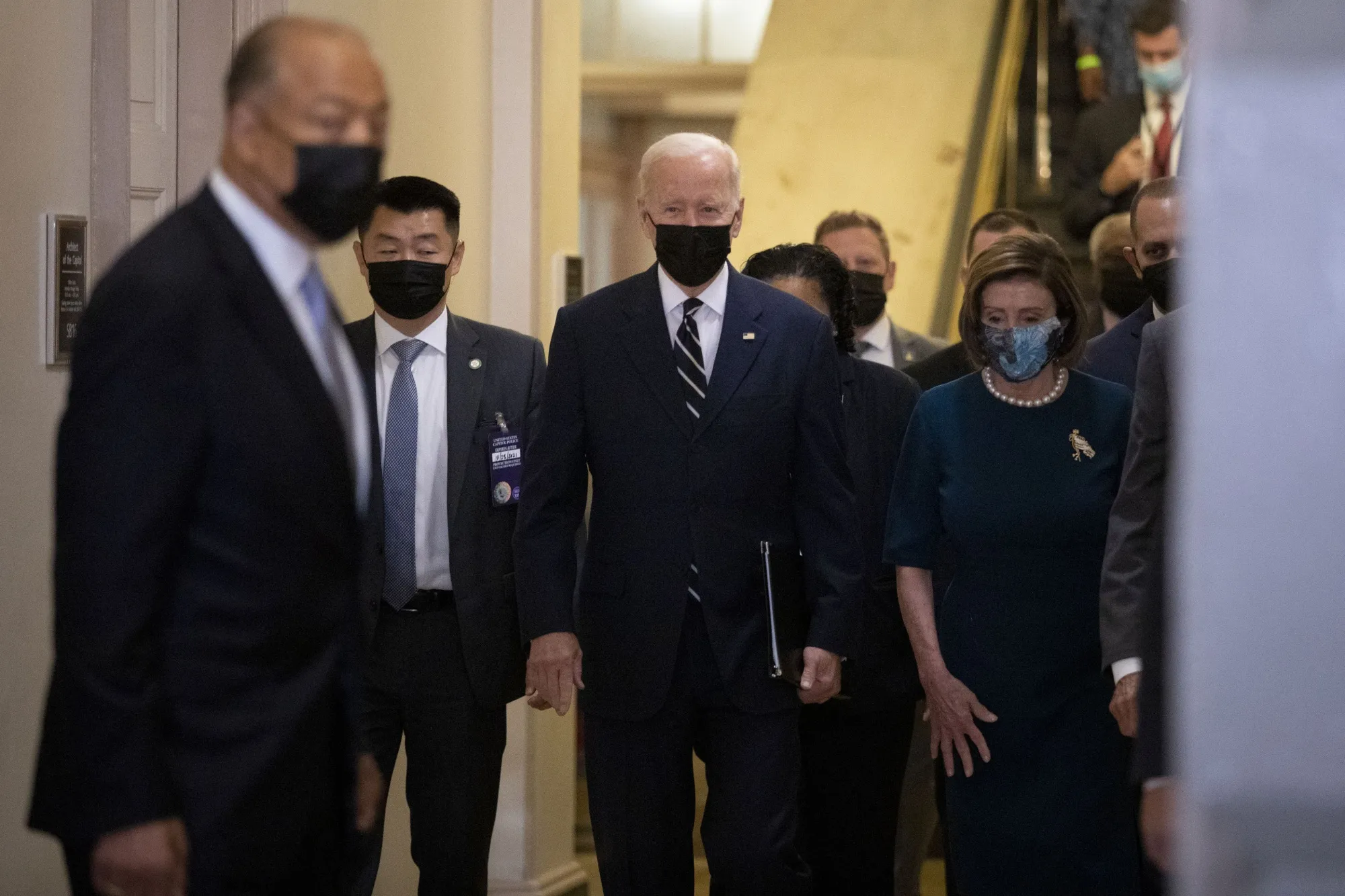 Joe Biden, center, arrives to the U.S. Capitol with U.S. House Speaker Nancy Pelosi, right, before a House Democratic caucus meeting in Washington, D.C., on Oct. 28.