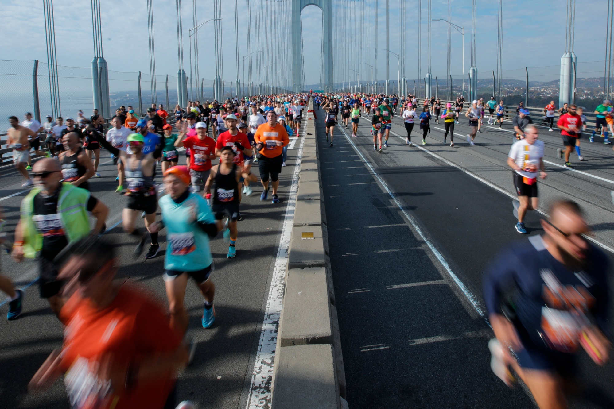 Runners cross the Verrazano Bridge before competing in the 52nd Edition of the New York City Marathon on November 5, 2023. (Photo by KENA BETANCUR / AFP) (Photo by KENA BETANCUR/AFP via Getty Images) Photographer: KENA BETANCUR/AFP/Getty Images
