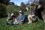 Swiss farmer Armin Capaul poses with one of his cows ahead of the nationwide vote on cow horns.&nbsp;
