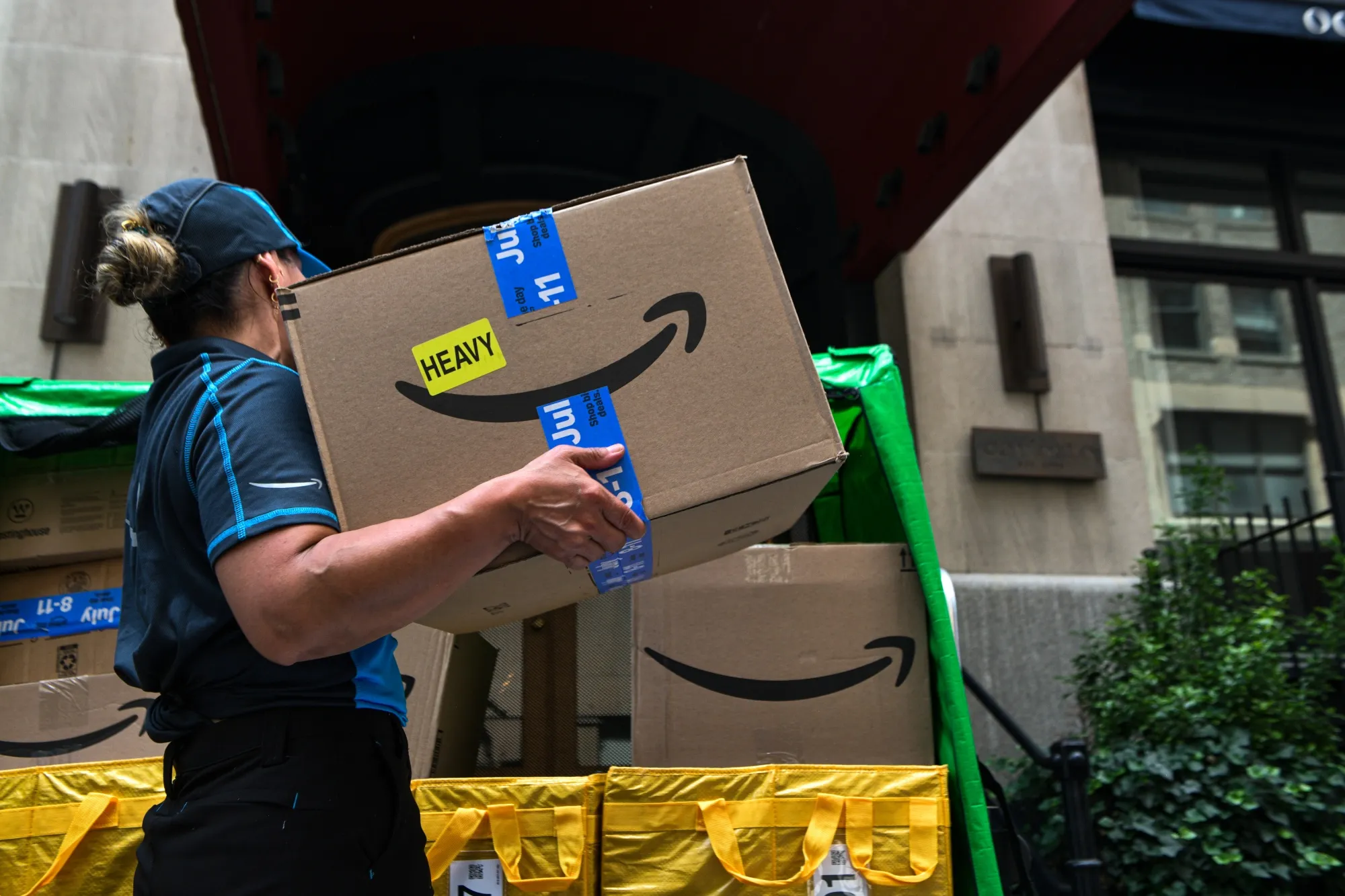 A worker sorts packages on Amazon Prime Day in New York on July 8.