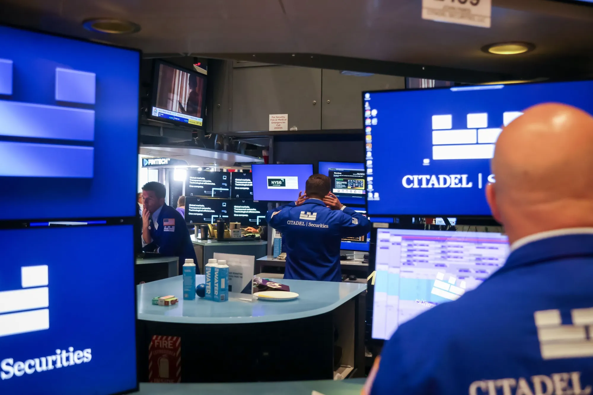 Traders work on the floor at the New York Stock Exchange in New York.