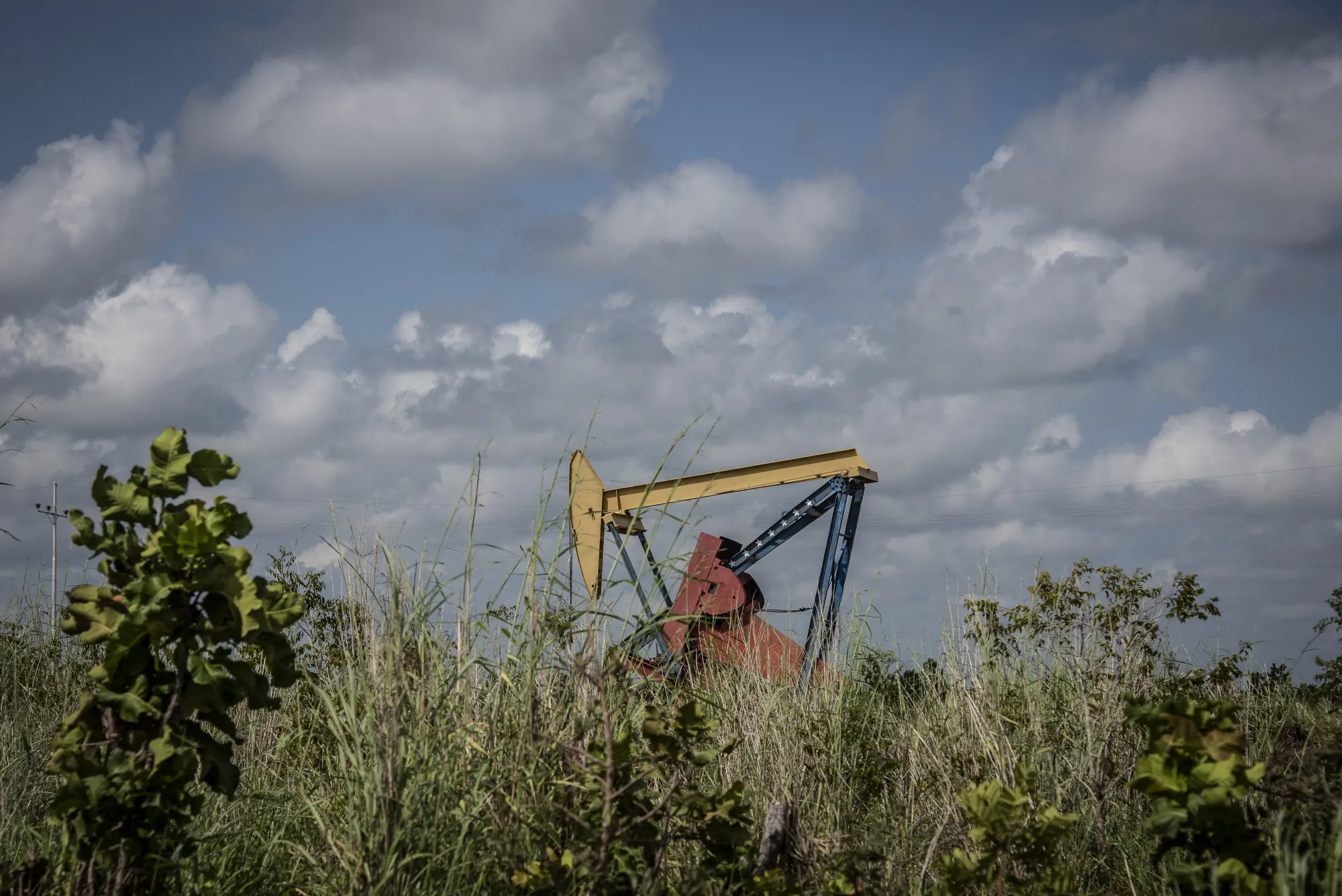 A pump jack stands at a PDVSA facility in El Tigre, Venezuela.