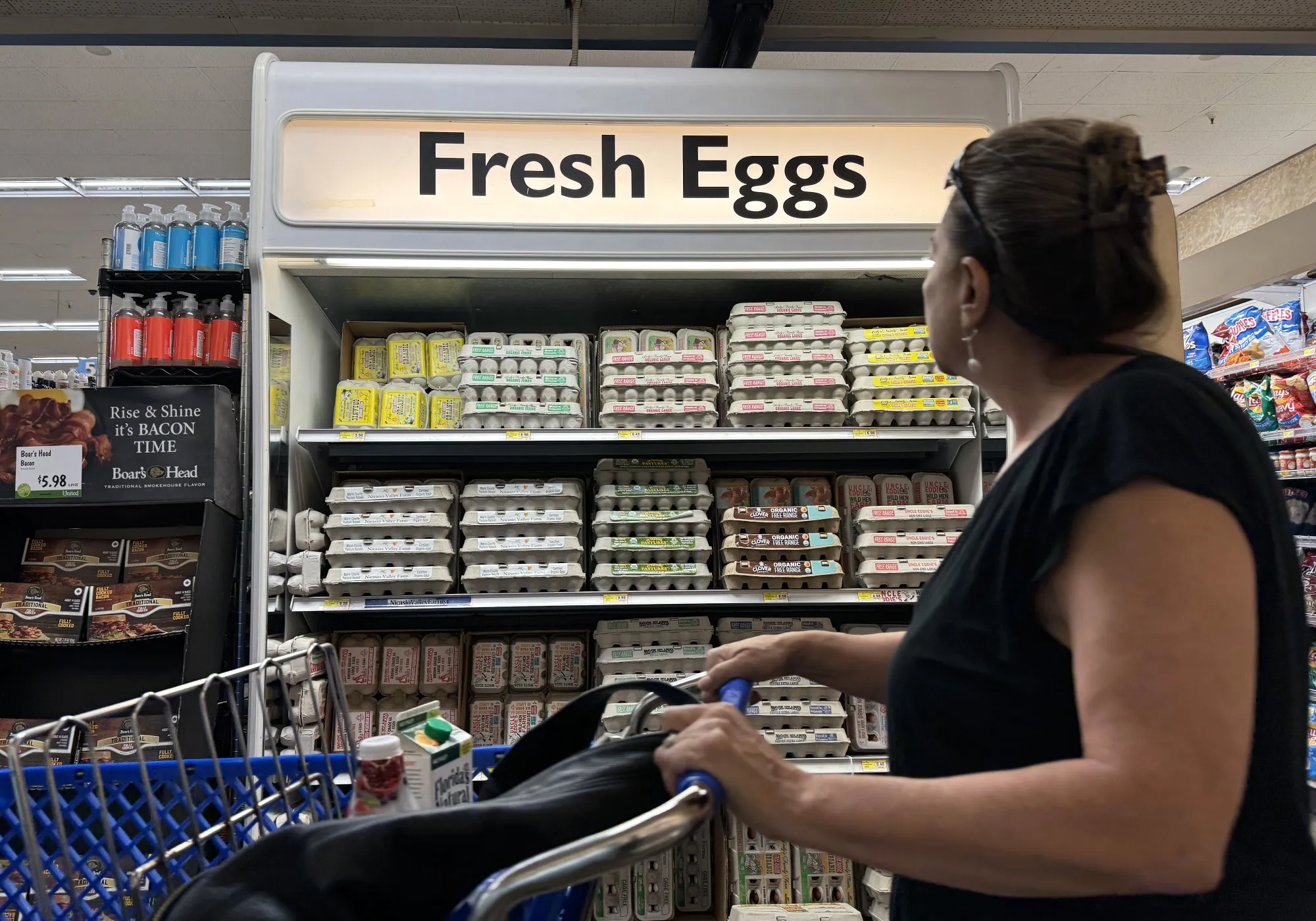 A customer walks by a display of fresh eggs at a grocery store on September 25, 2024 in San Anselmo, California.&nbsp;