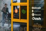 The logos of Bitcoin, Ethereum, Litecoin and Dash on a cryptocurrency ATM in Warsaw, Poland.