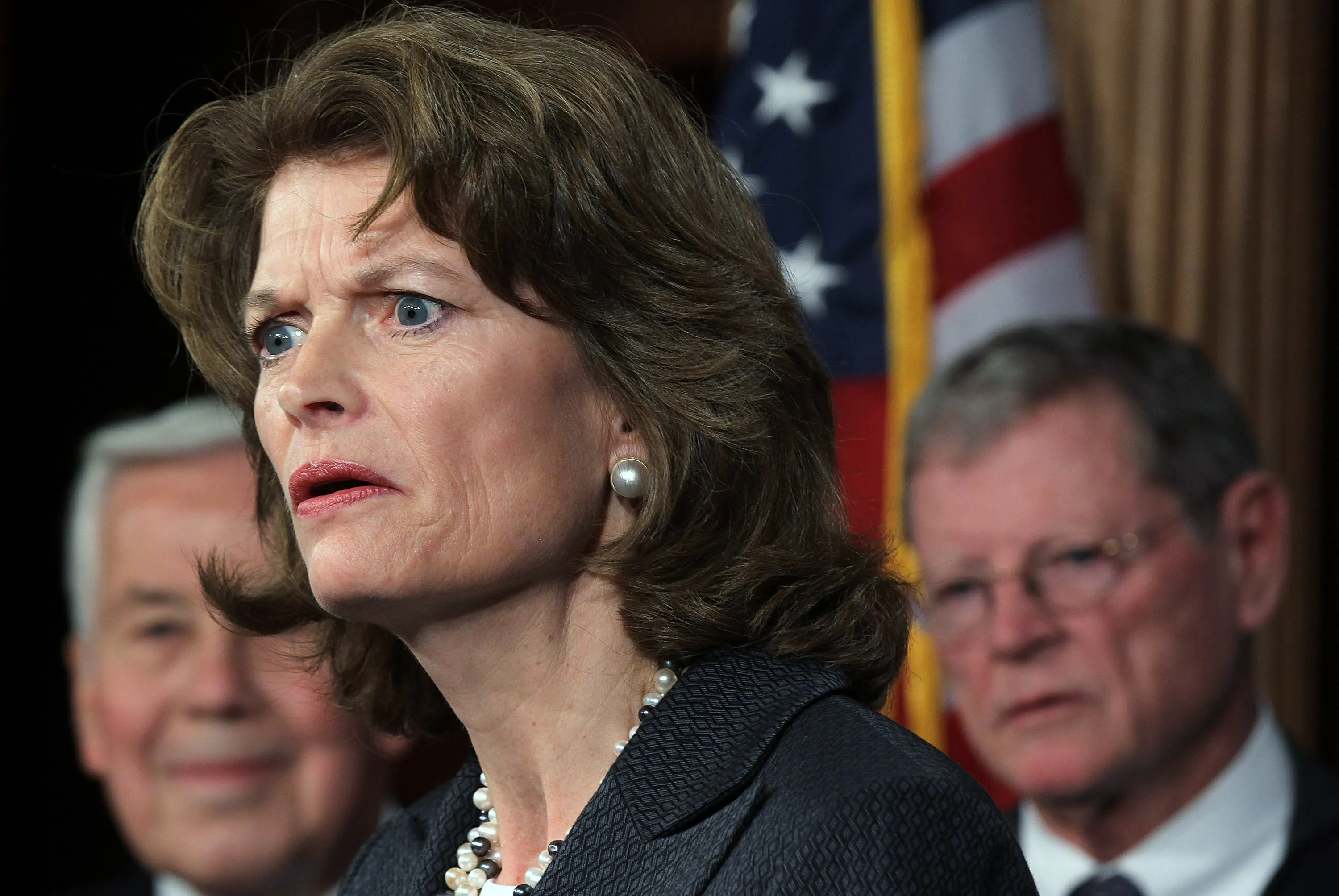 WASHINGTON, DC - NOVEMBER 30: U.S. Sen. Lisa Murkowski (R-AK) (C) speaks as Sen. Richard Lugar (R-IN) (L) and Sen. James Inhofe (R-OK) (R) listen during a news conference November 30, 2011 on Capitol Hill in Washington, DC. The Republican senators held the news conference to discuss an energy legislation regarding the Keystone XL Pipeline.
