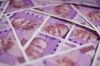 Indian two thousand rupee banknotes are arranged for a photograph in Mumbai, India, on Tuesday, Jan. 30, 2018. Indian Prime Minister Narendra Modi has a tough balancing act in this week's budget: maintaining fiscal prudence or handing out cash to placate rural voters ahead of next year's election.