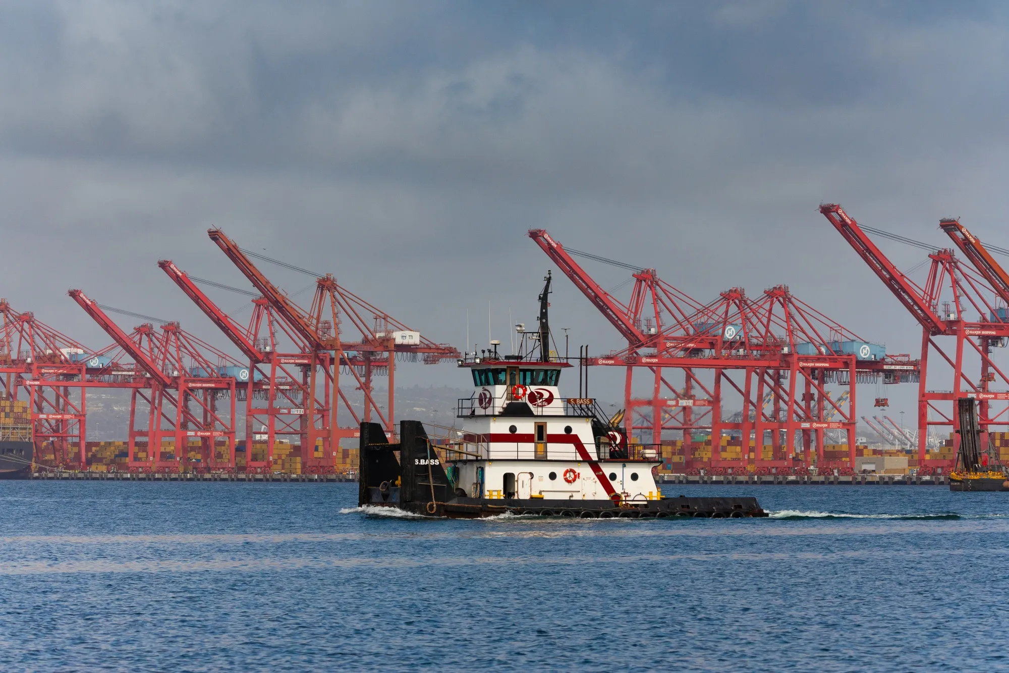 A boat passes by&nbsp;the Long Beach port&nbsp;in California in May.